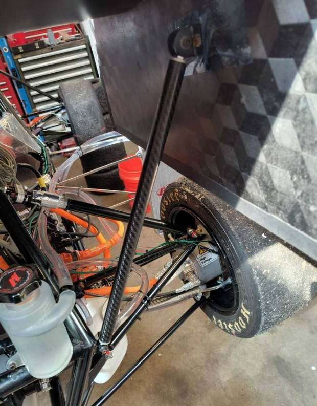 Carbon strut connecting the rear wing mount to the chassis