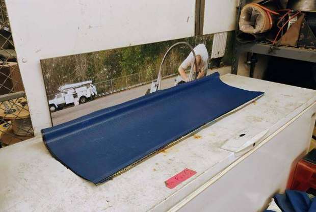 Blue-backed prepreg laid over a wing mold